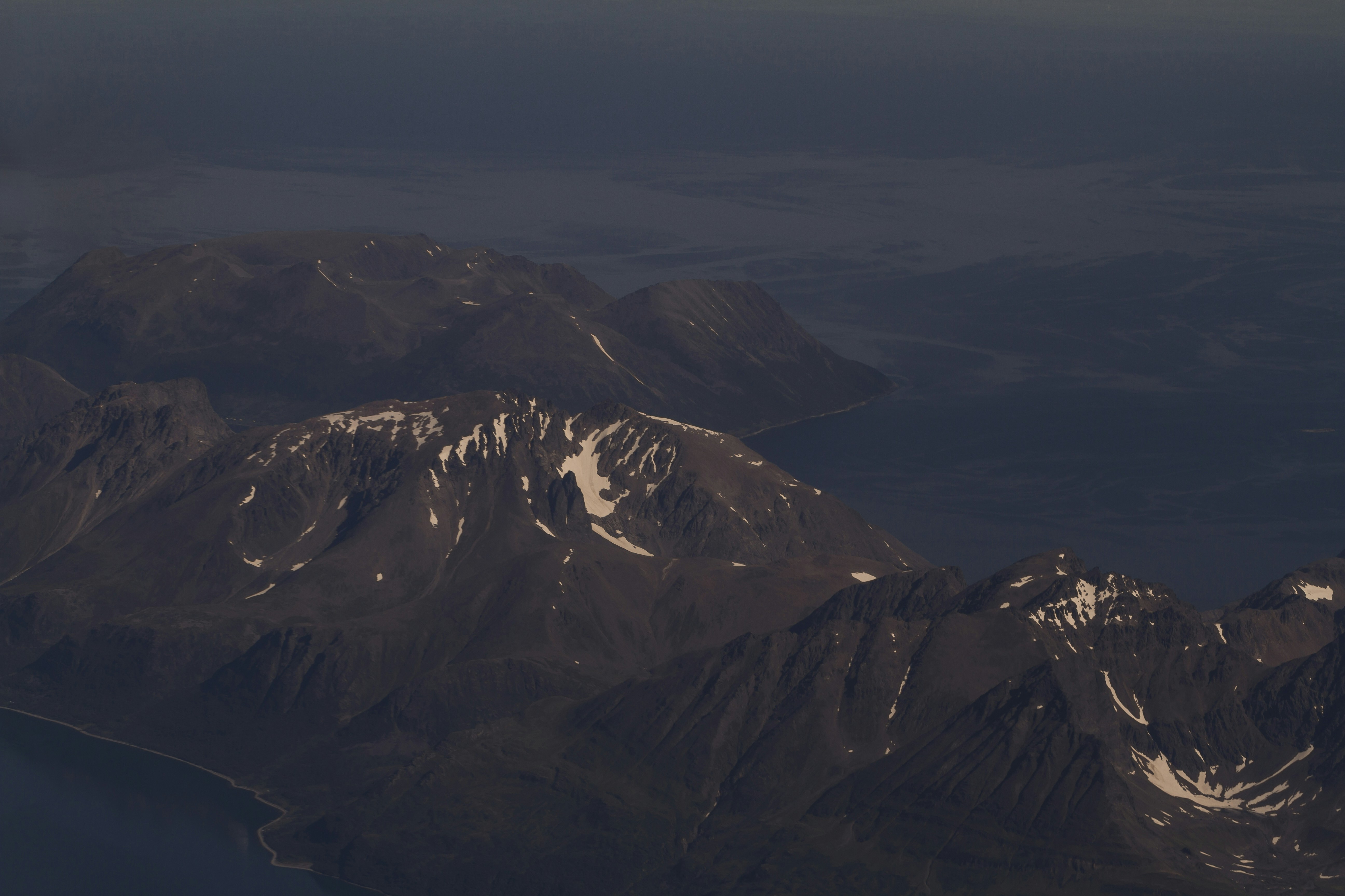 aerial photography of mountains moody teams background