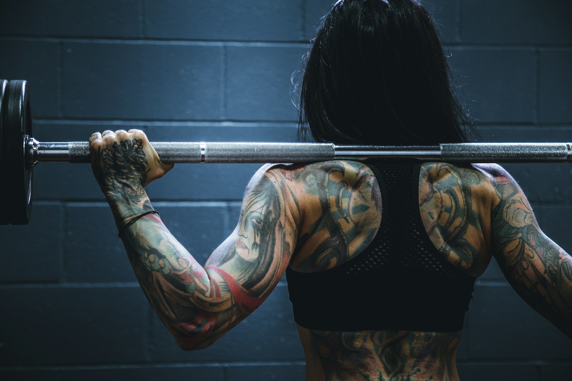 Person resting between sets at the gym