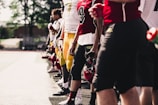 A vibrant football team proudly wearing personalized jerseys with player names and numbers on a sunny field