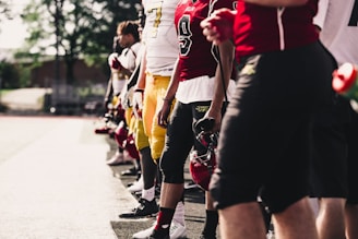 two yellow-and-red football jerseys