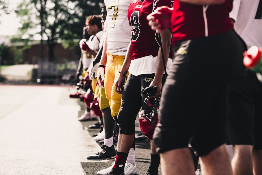 two yellow-and-red football jerseys