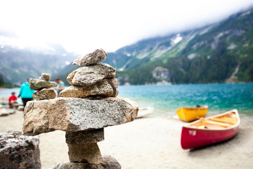 selective focus photography of cairn stone at daytime