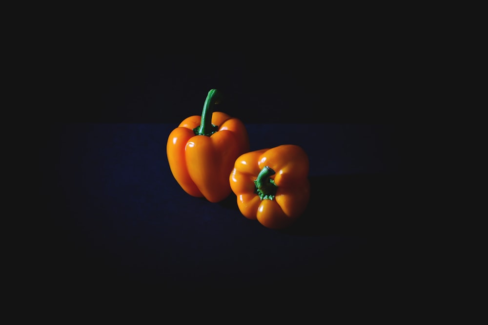 two orange bell peppers