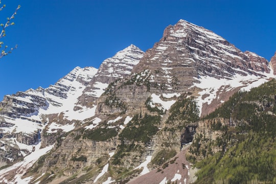 brown mountain covered by snow at daytime in Maroon-Snowmass Trailhead United States