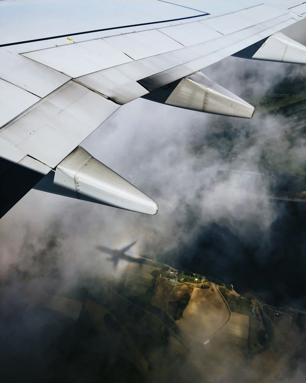 white airplane over the clouds