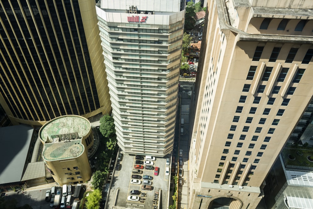 aerial photography of car lot parked on parking area beside building