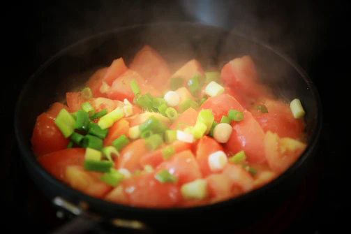 Pomodoro team capturing food styling with genuine laughter and focus.