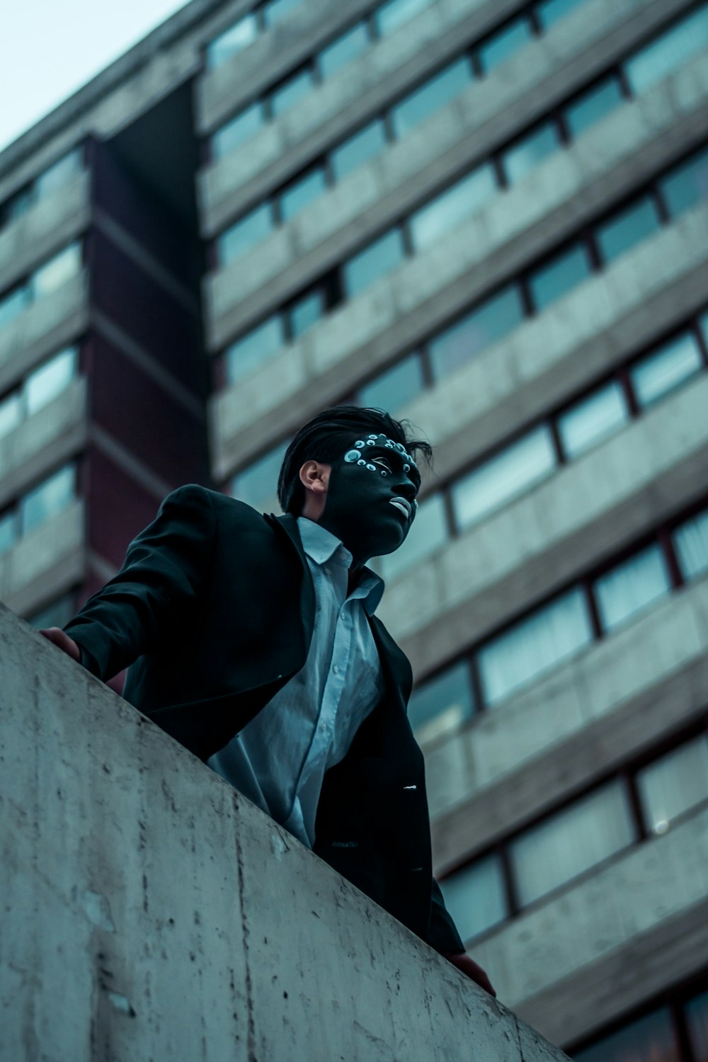 man standing on roof top