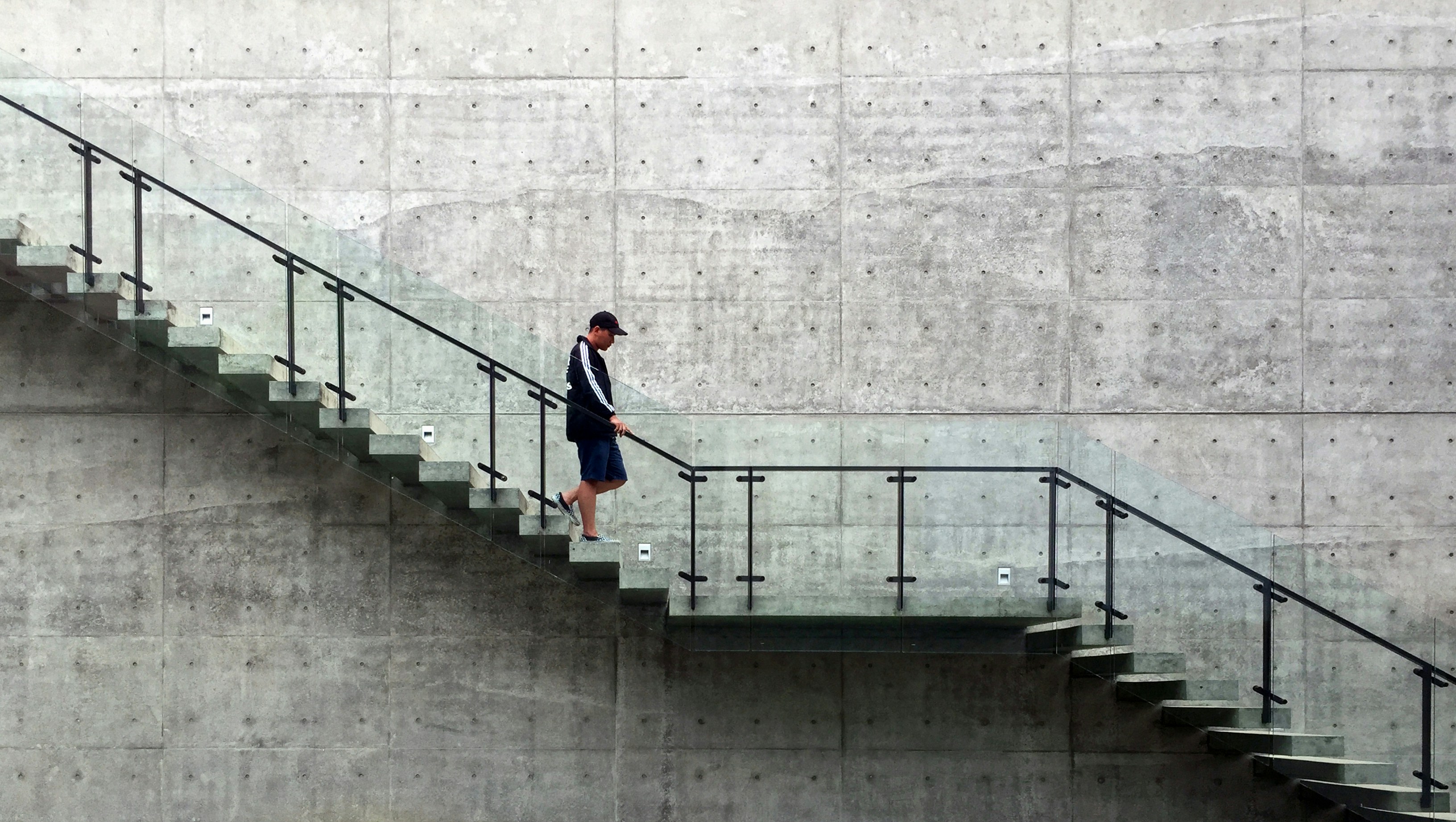 Person Going Downstairs Photo Free Grey Image On Unsplash