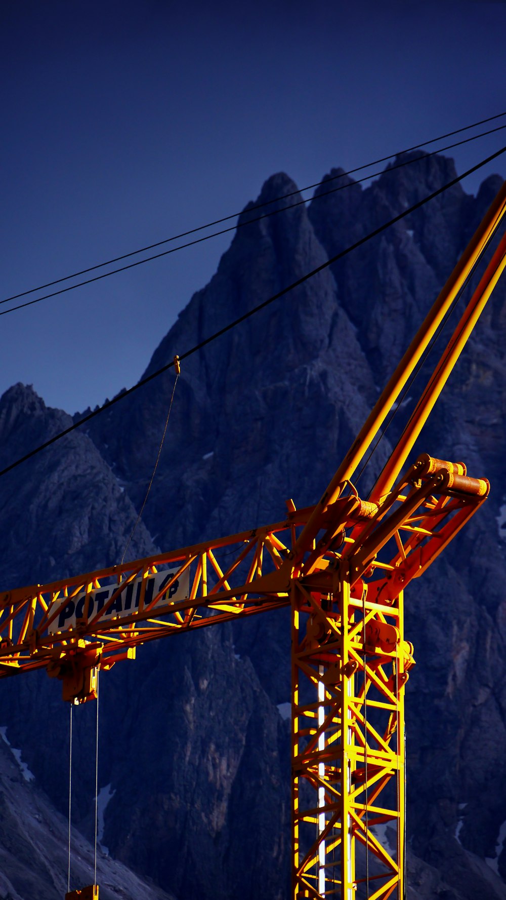 close-up photo of orange truck crane