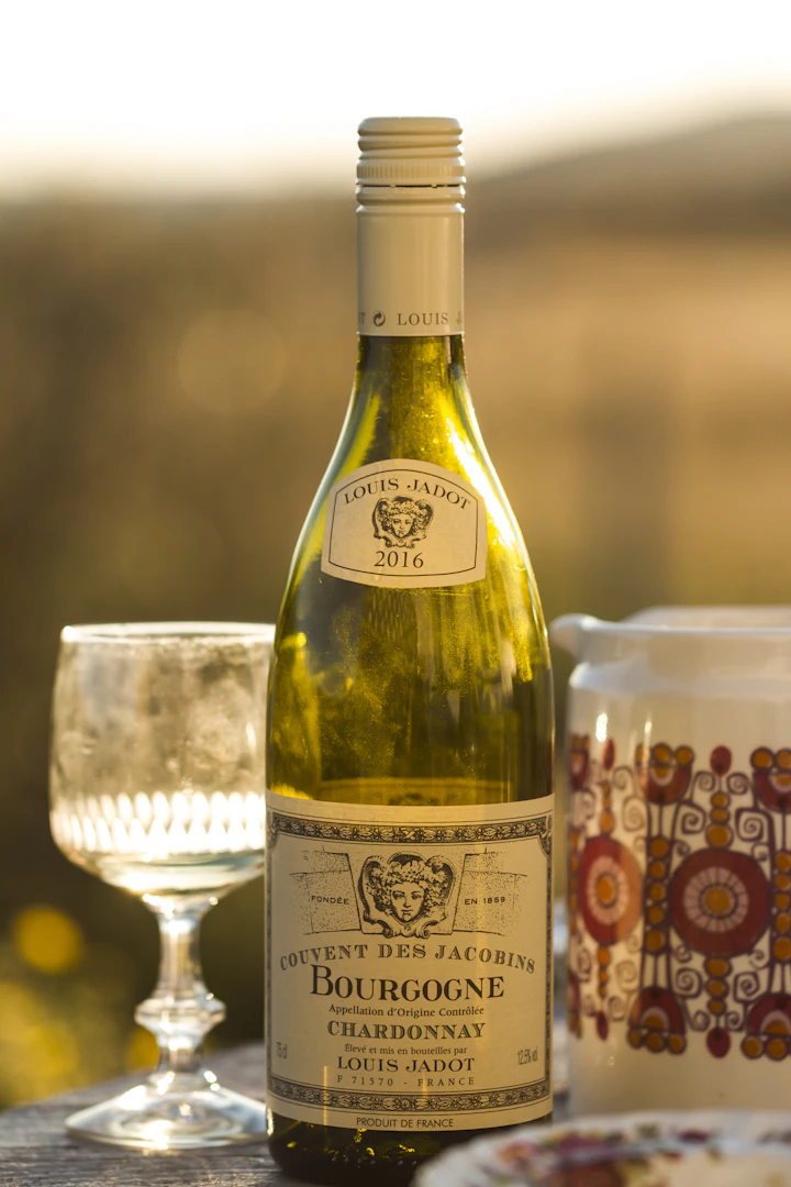 A white Burgundy bottle with selective-focus photography on a soft background