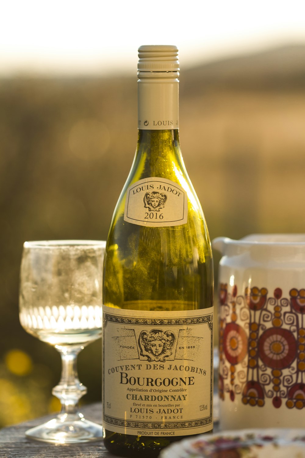 selective focus photography of Bourgogne bottle