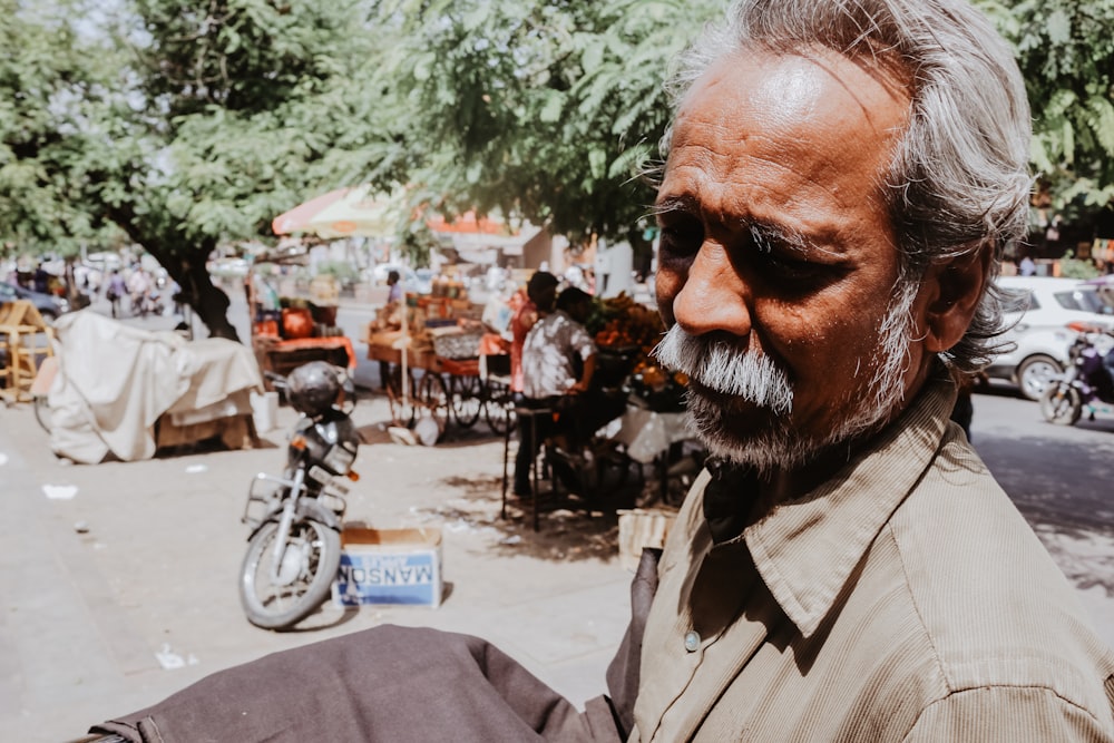 man wearing brown shirt duirng daytime