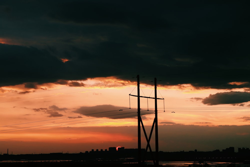 electric post under white clouds