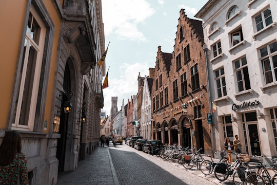 bicycle parked beside buildings in Belfry of Bruges Belgium