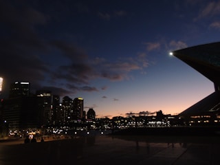A sleek cinematic shot of a city skyline at dusk with soft lighting.