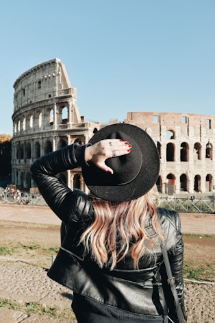 woman looking at Colosseum in Rome