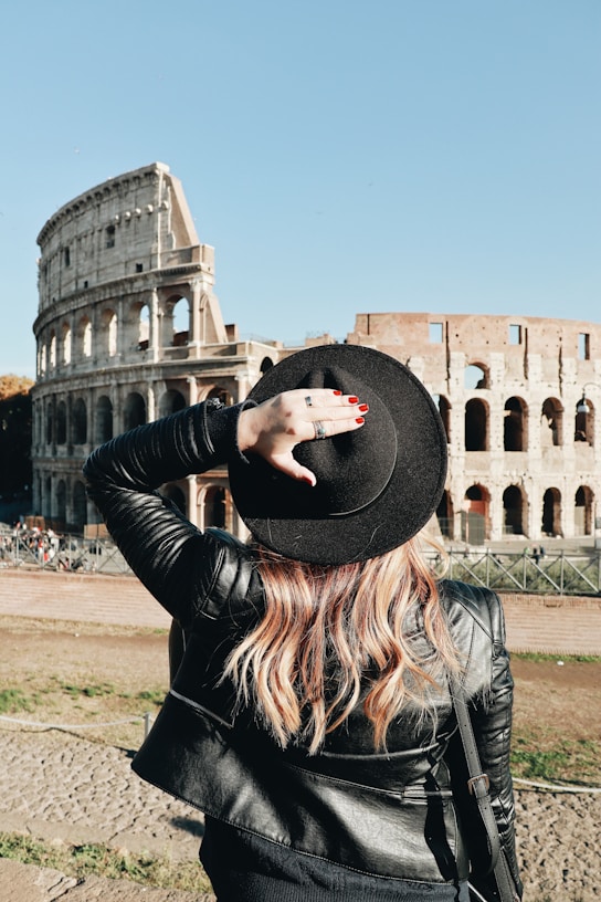 woman looking at Colosseum in Rome