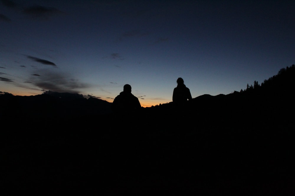 silhouette photo of man and woman