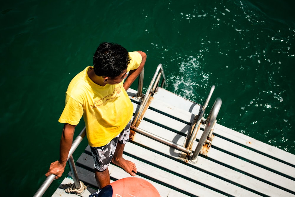 man standing on powerboat