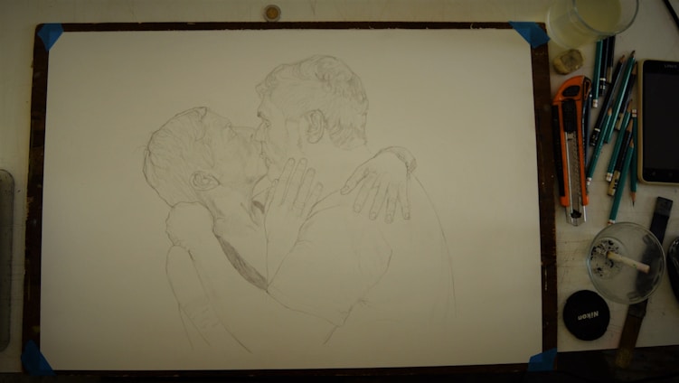 An artist gently sketching a heartfelt portrait of a smiling couple, with soft pencils and warm lighting.