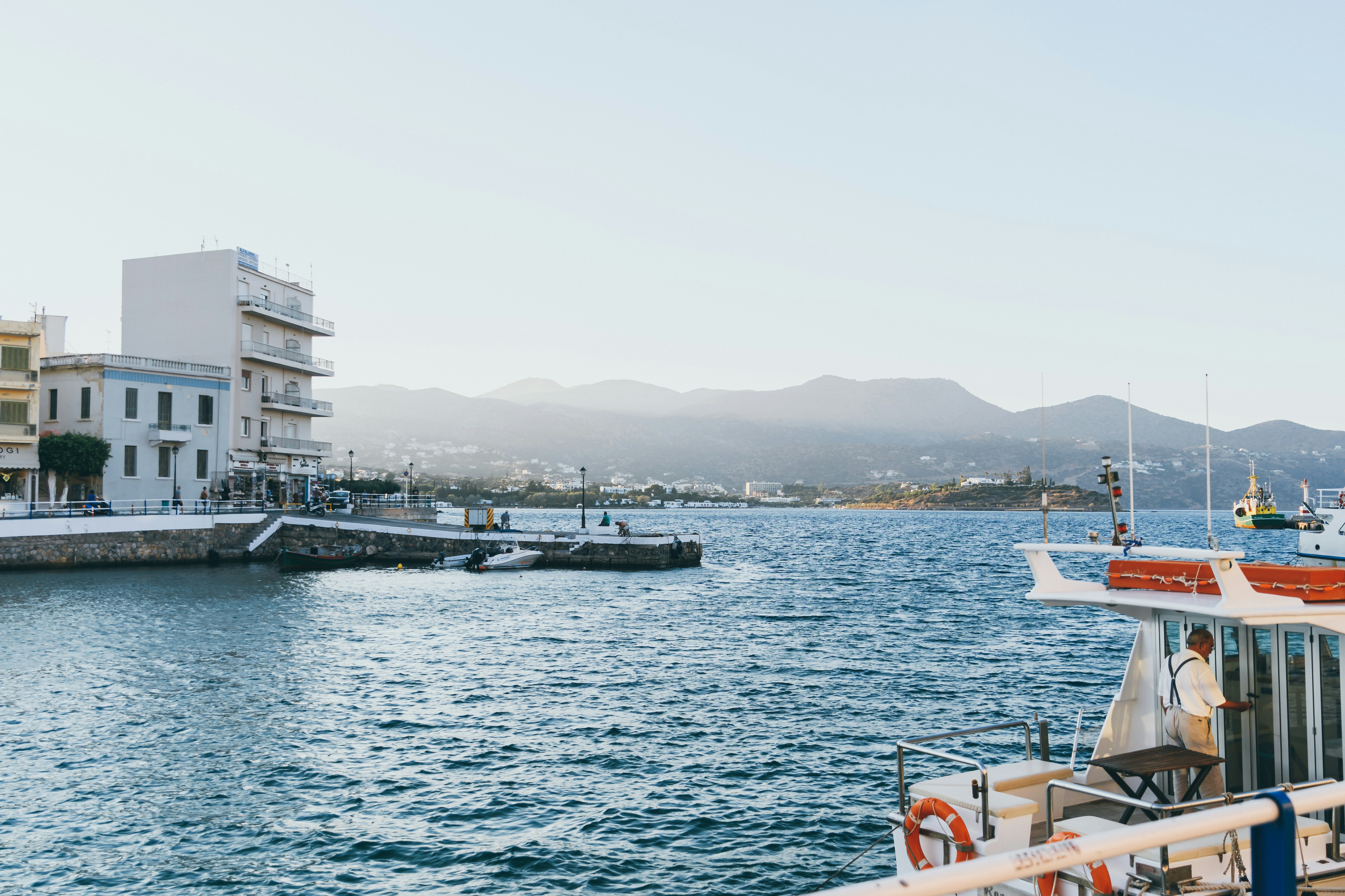 man riding on ship during daytime