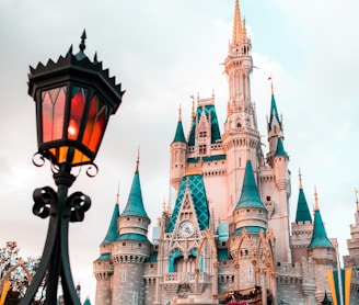 white and blue castle under cloudy sky during daytime