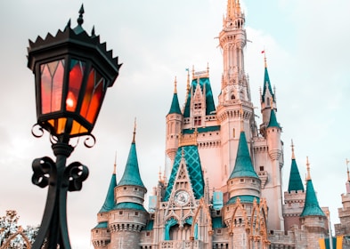 white and blue castle under cloudy sky during daytime