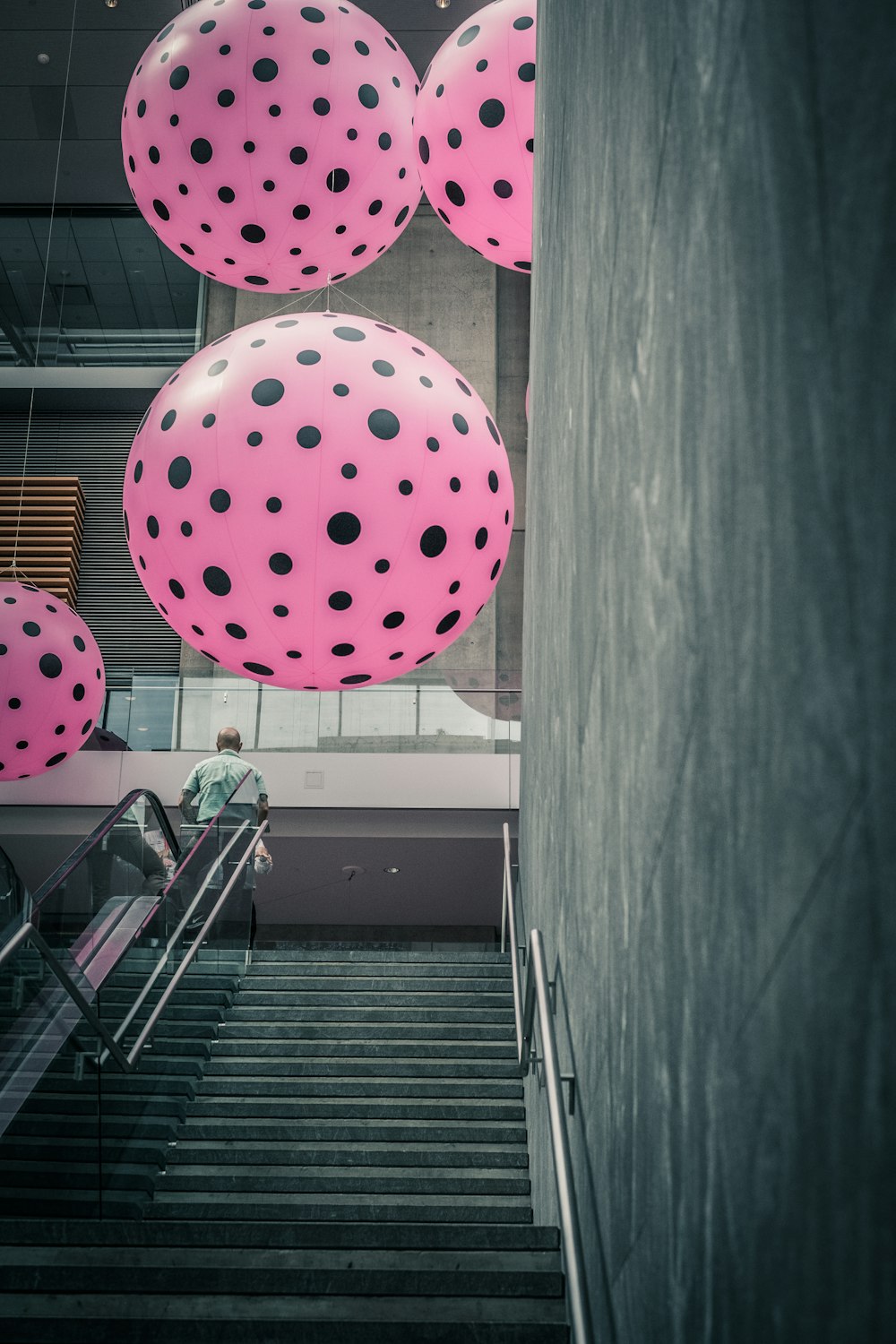 four black-and-pink balloons at daytime