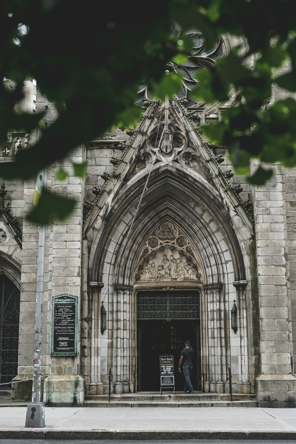 person walking towards building at daytime