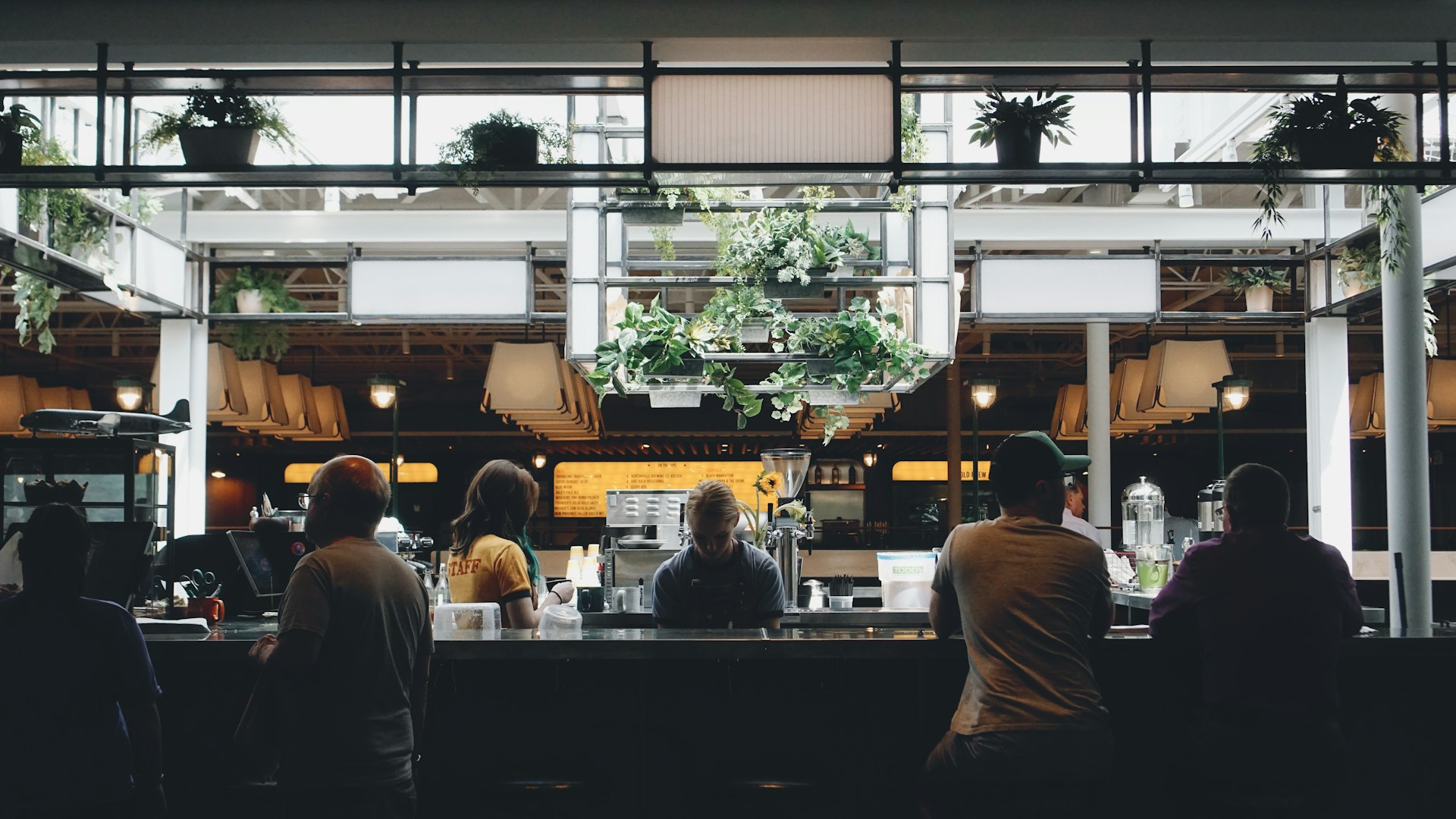 people sitting near stall