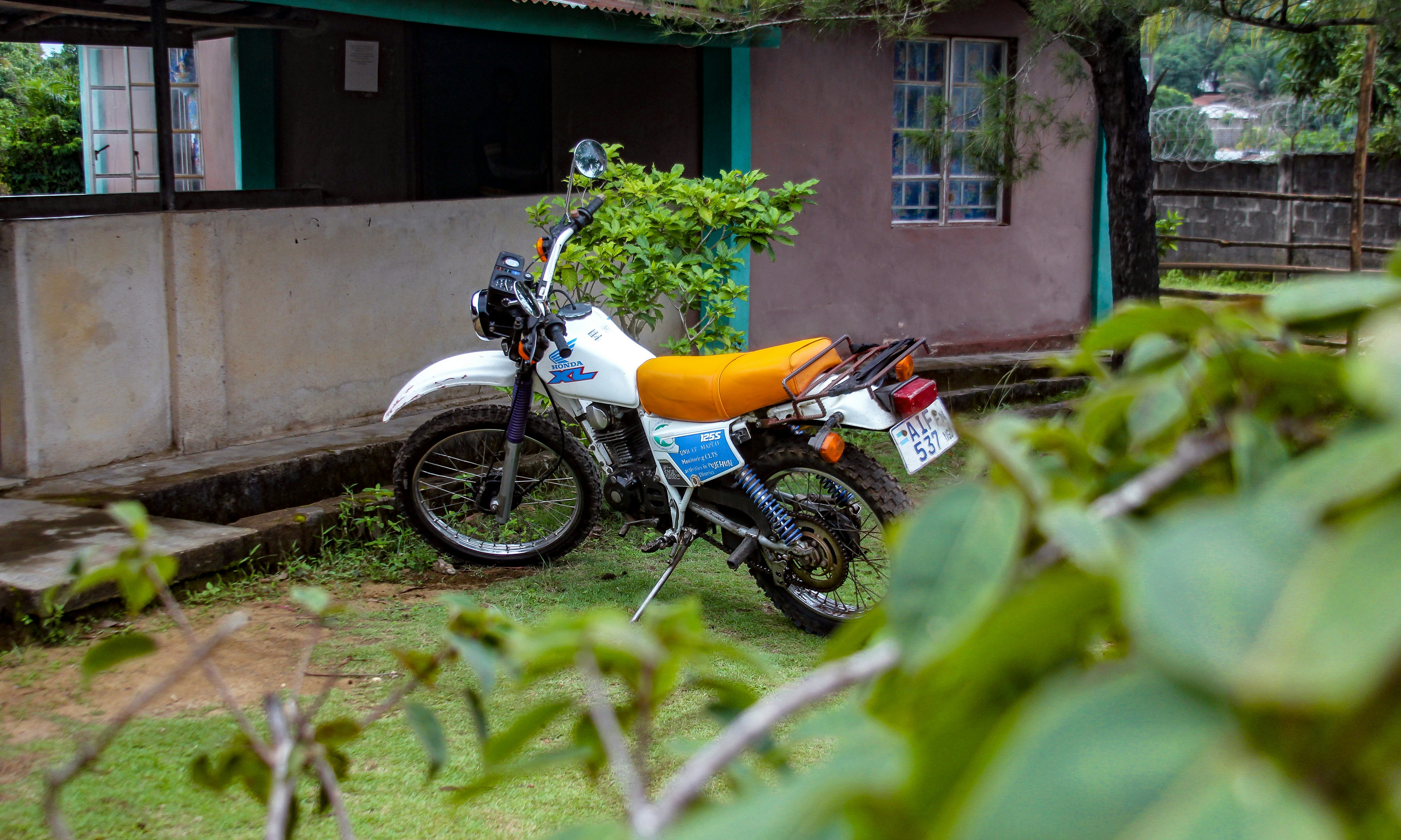 white and blue motocross dirt bike sierra leone teams background
