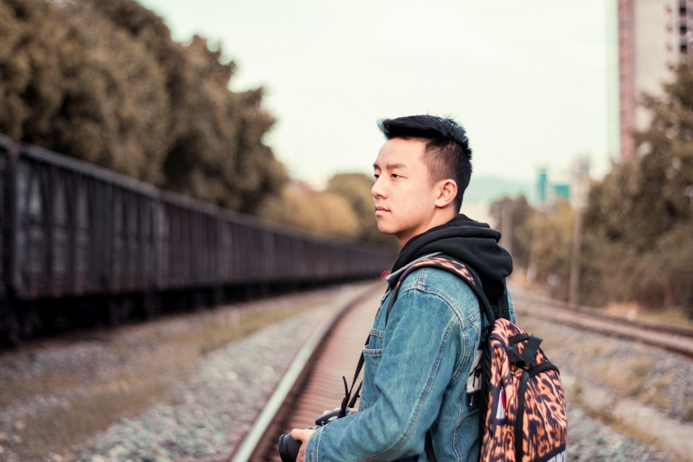 person holding black DSLR camera