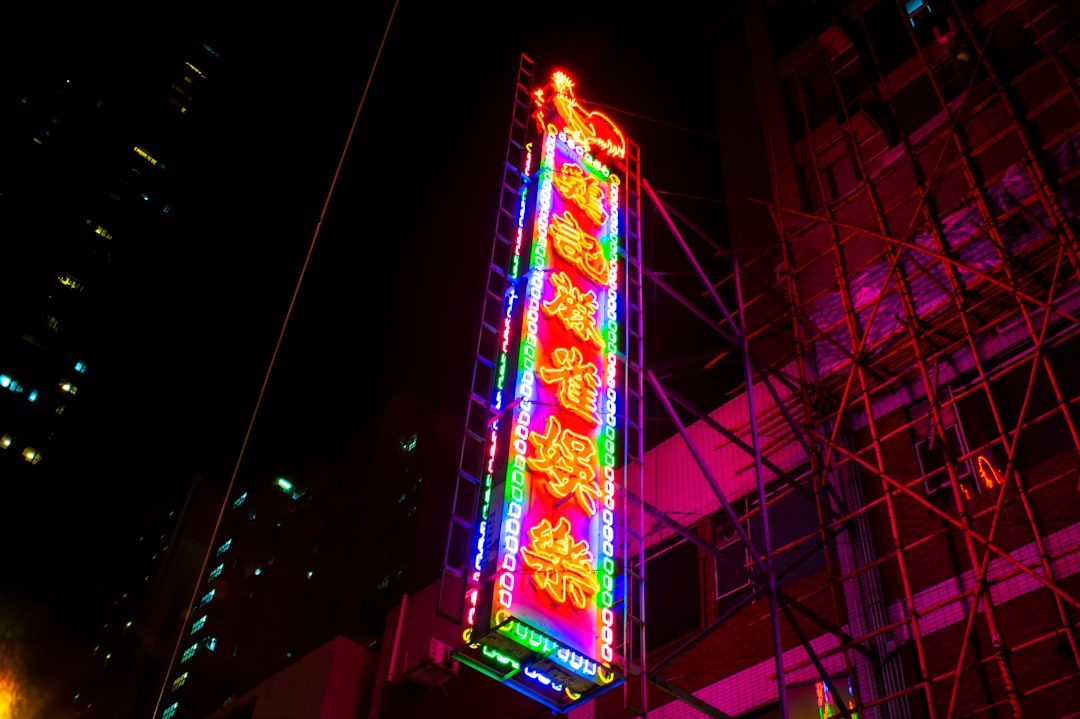 lighted green, red, and orange kanji signage during nighttime