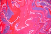 a close up of a red and purple liquid