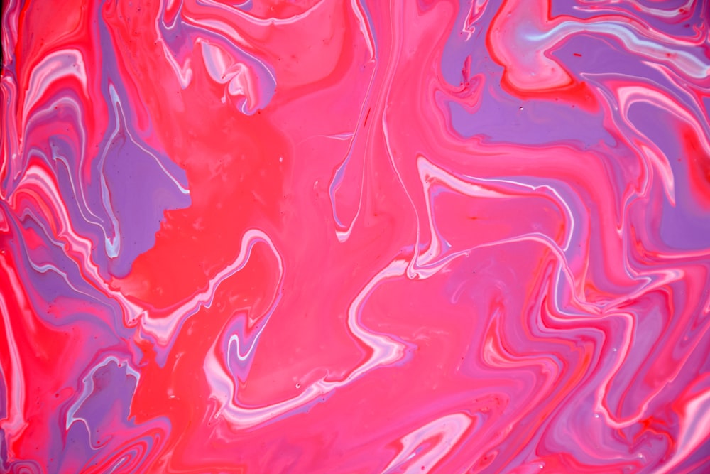 a close up of a red and purple liquid