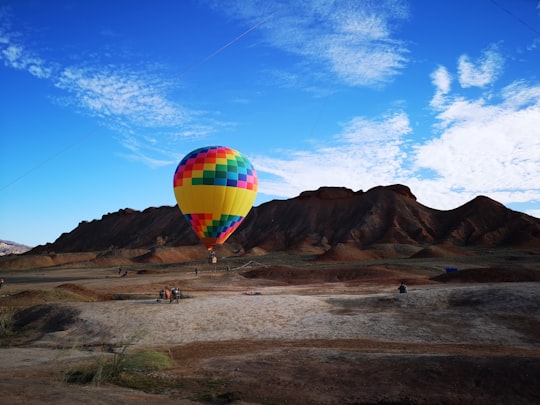 hot air balloon near mountains in Gansu China