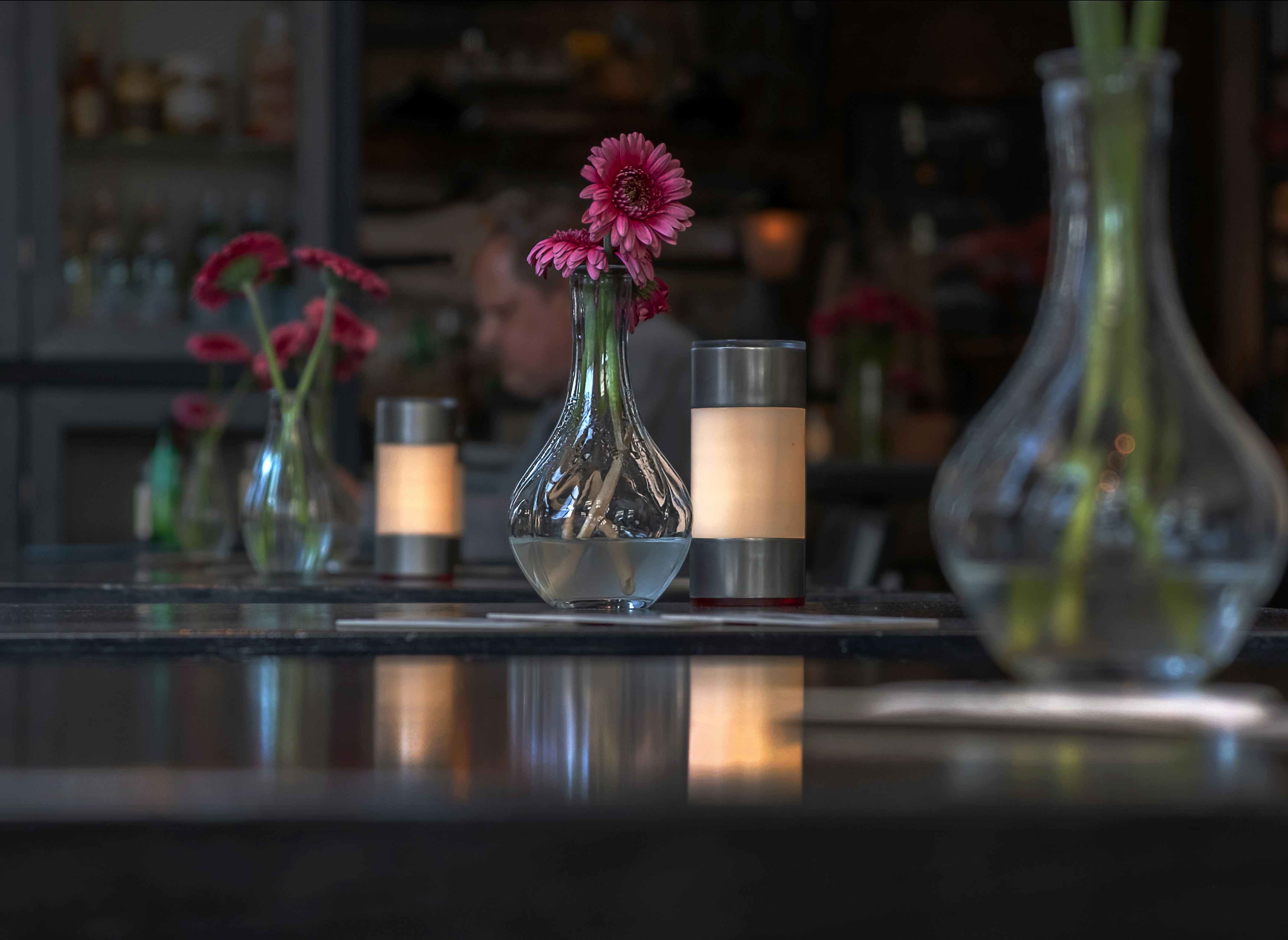 pink petaled flower in vase on tabletop