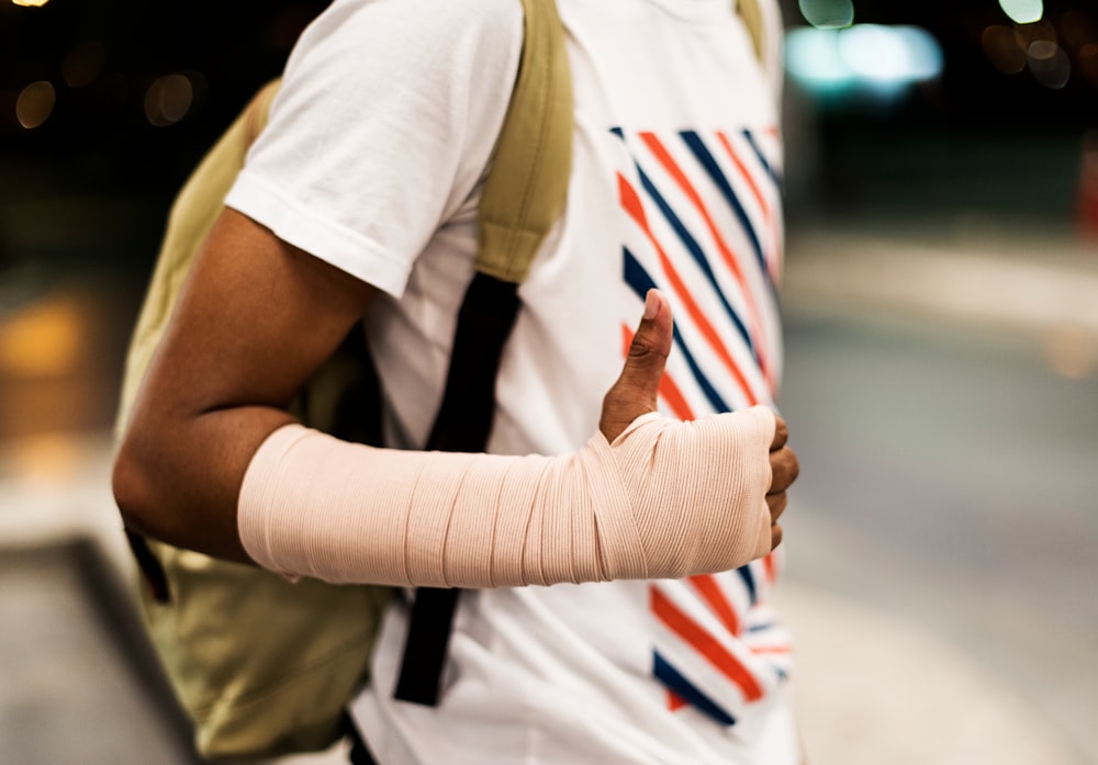 man with hand bandage calls Car accident lawyer