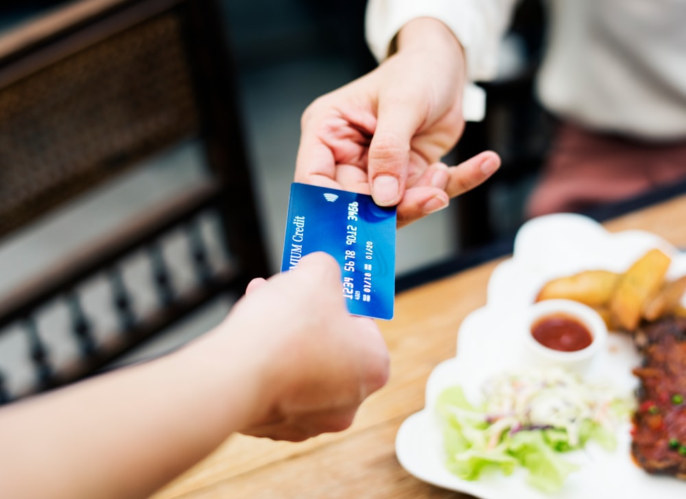 person holding a credit card