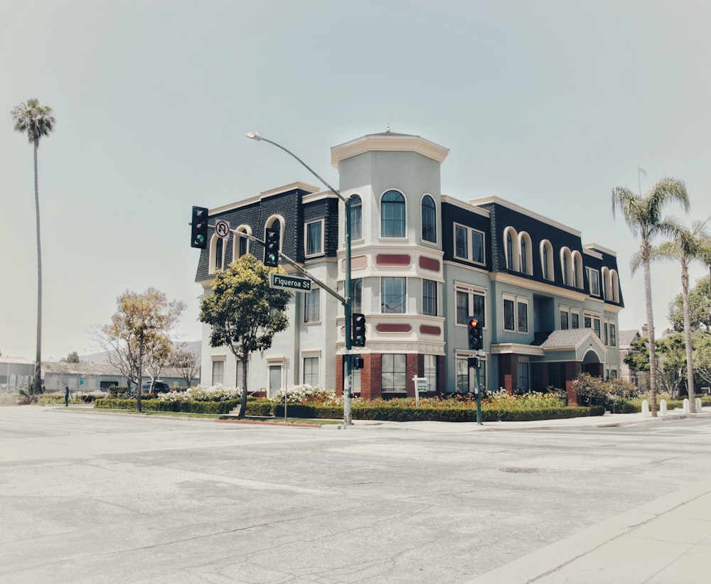 white and blue corner building