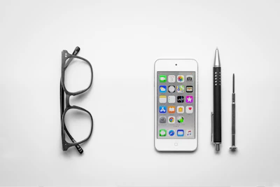 Close-up of Ethan's hands arranging minimalist brand design elements on a workspace.