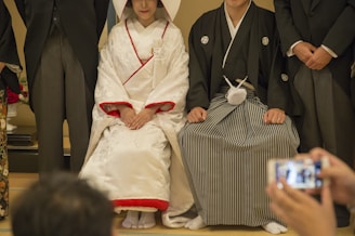 woman sitting beside man