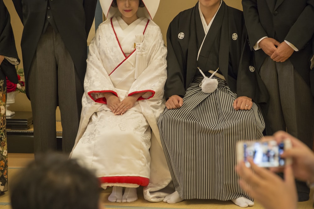 woman sitting beside man