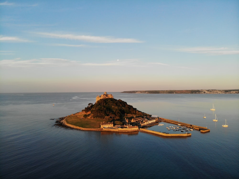 aerial photo of island with dock during daytime