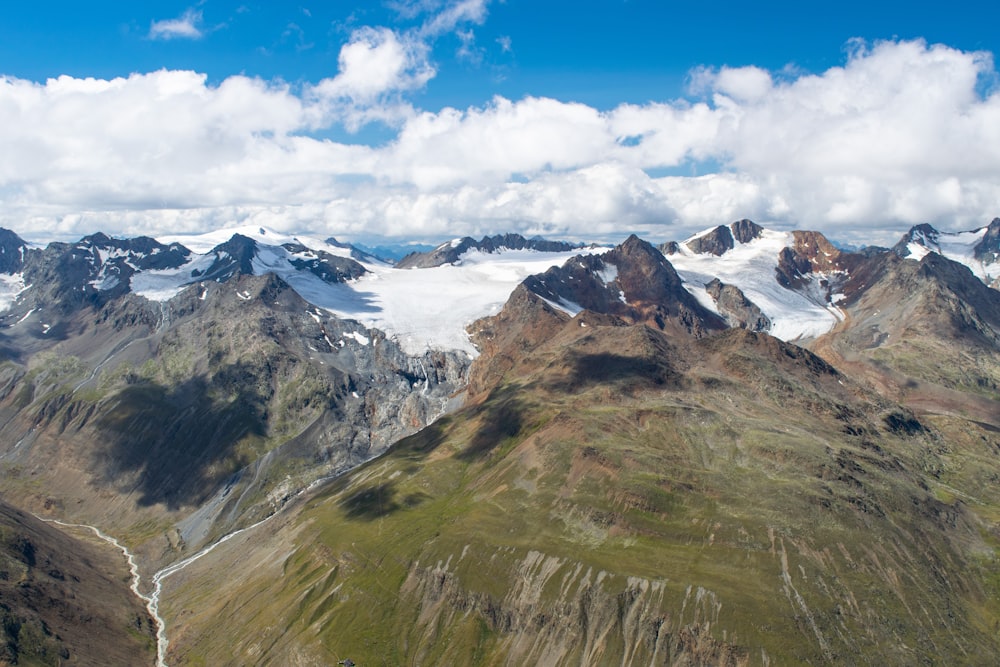 photo of mountains near body of water