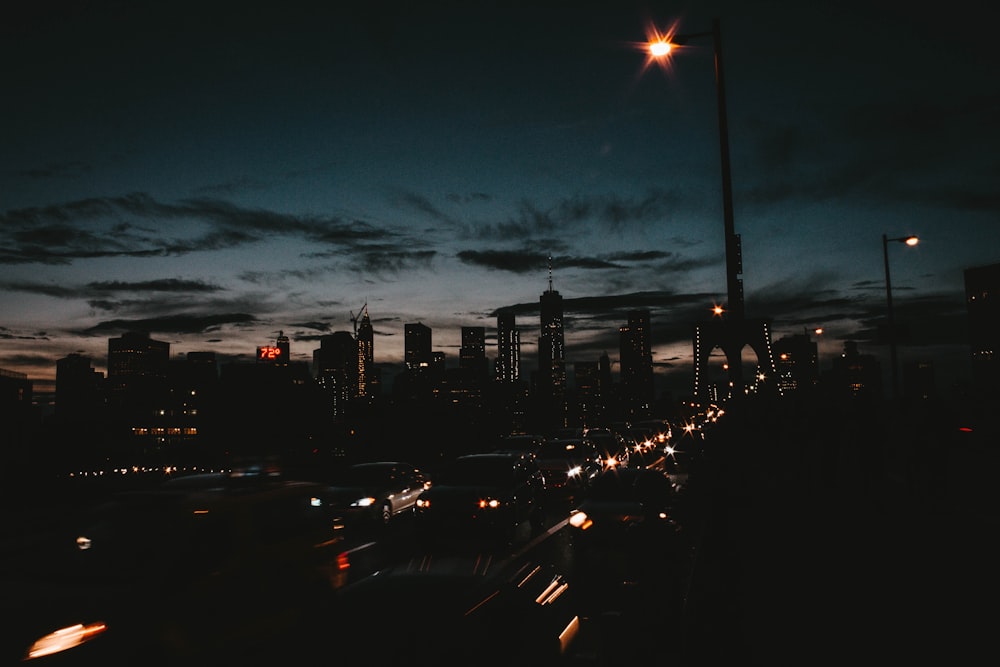 photo of busy road near high-rise buildings