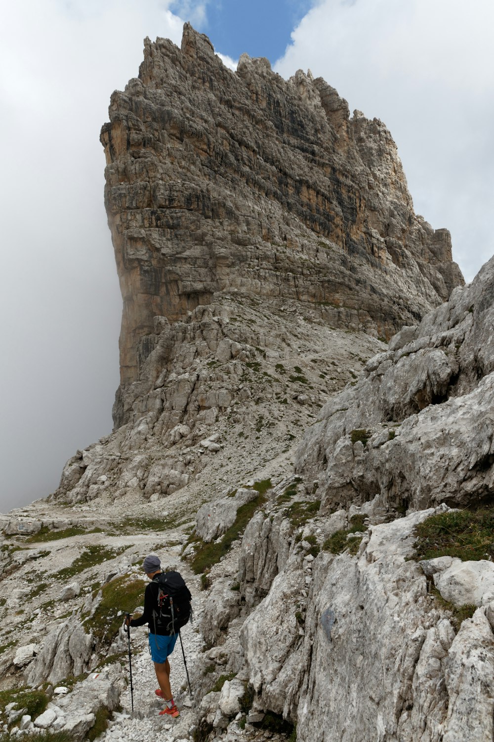 man standing on rocking mountain