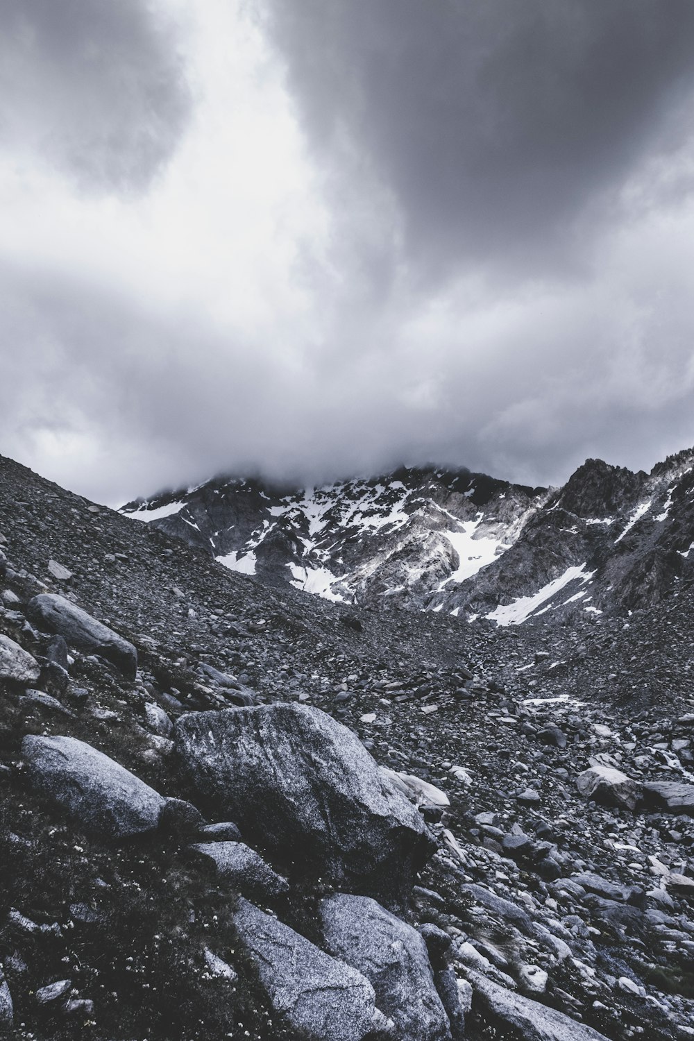 gray mountain under gray clouds during daytime