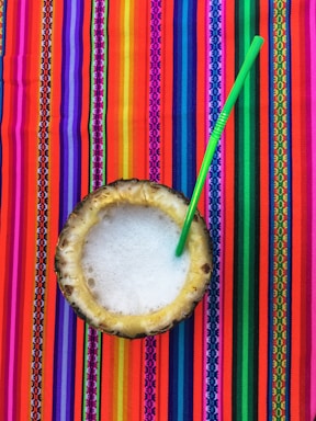 A vibrant fruit-filled pineapple serving as a refreshing dessert treat.